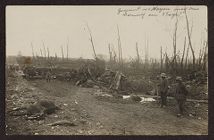 Soldiers in a debris ridden battlefield